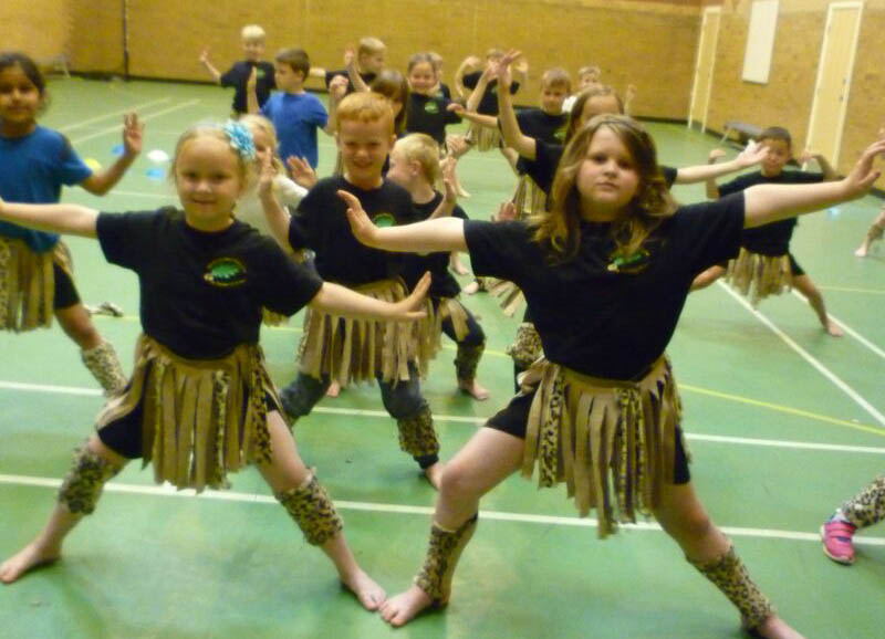 Children dancing in African dance costumes