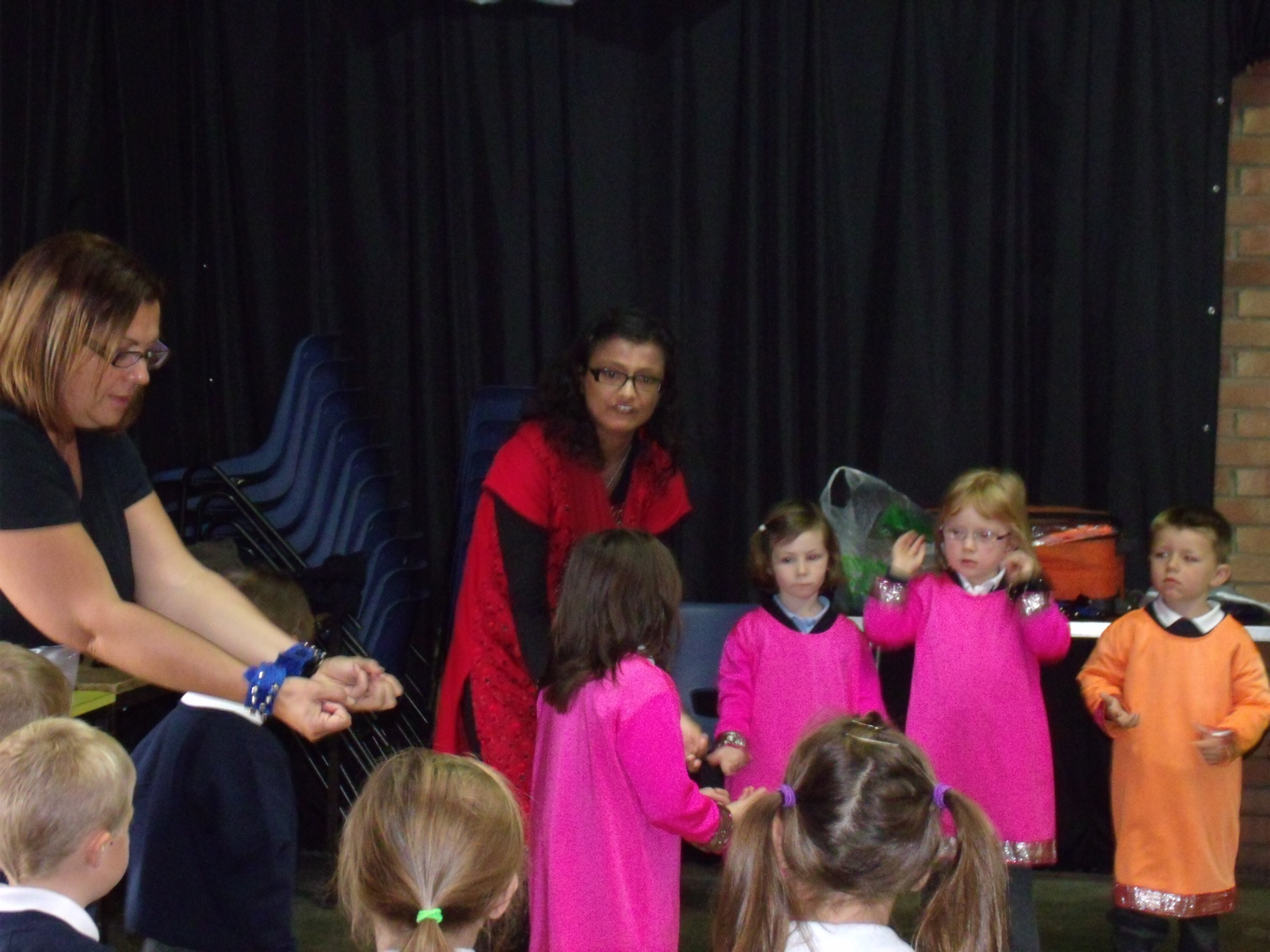 Children being taught Indian dance by teacher