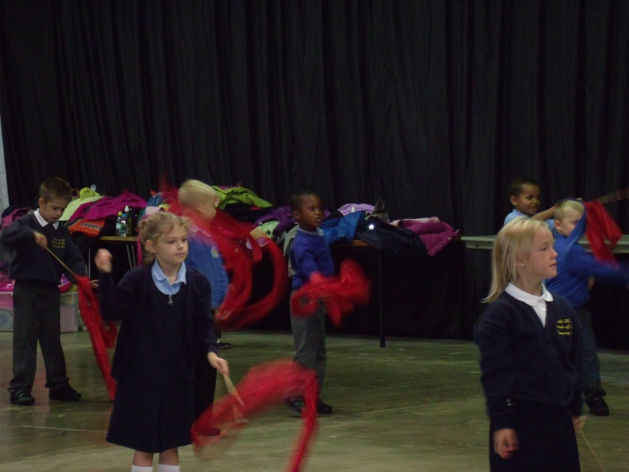 school children learning chinese dancing