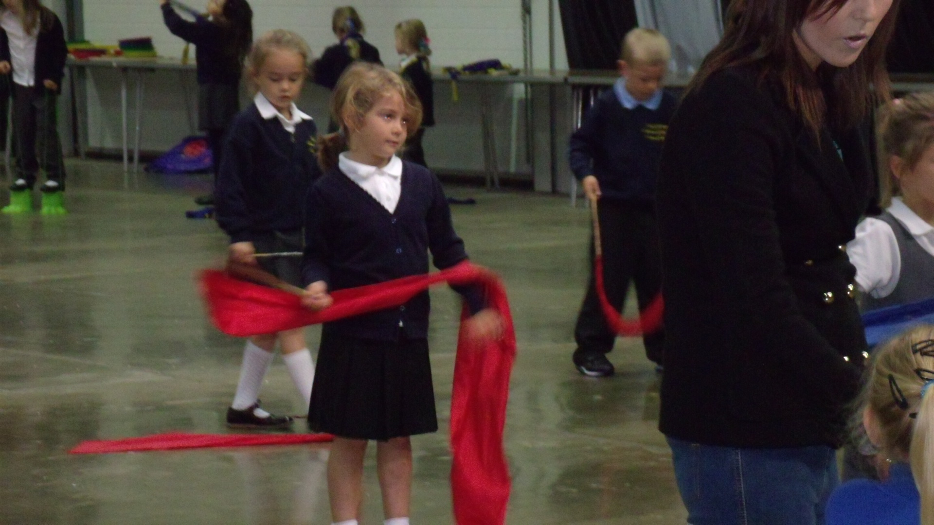 School children holding chinese dance ribbon