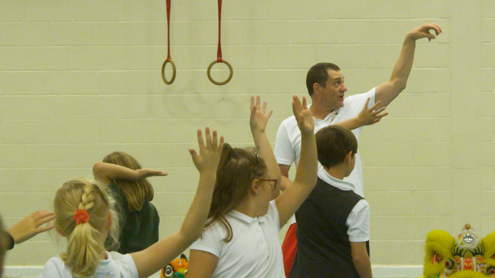 Children and teacher performing martial arts