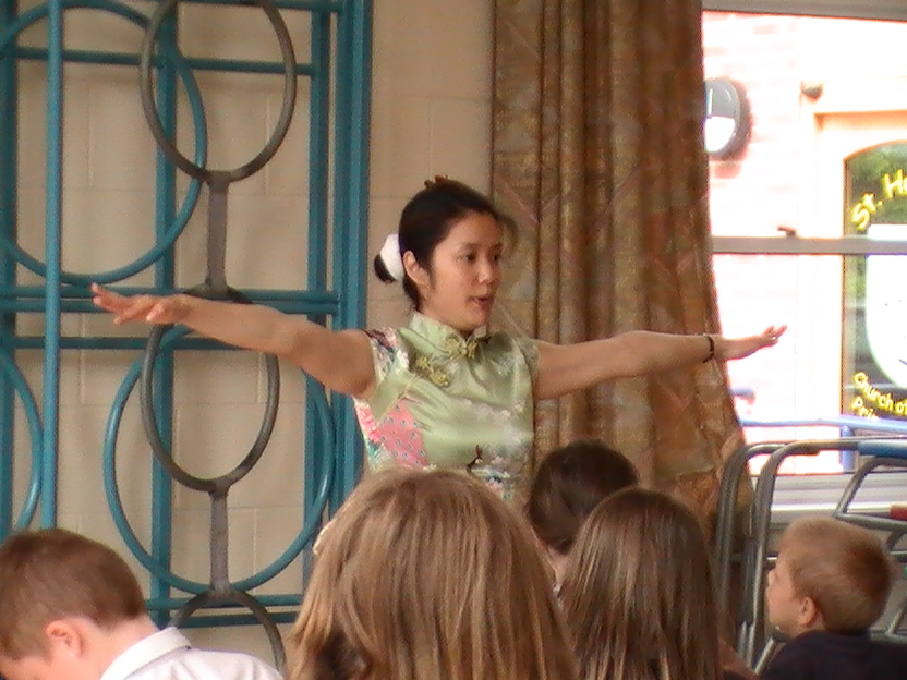 Teacher explaining how to chinese dance