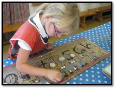 School children creating a mosaic