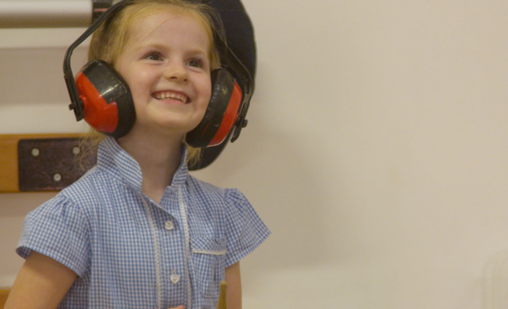 School children with ear muffs on